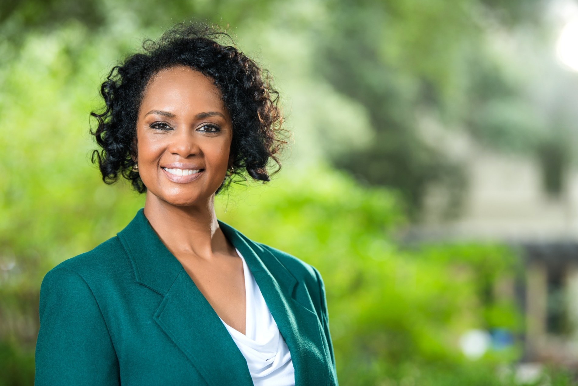 Teshia Young Roby outdoors wearing a green blazer