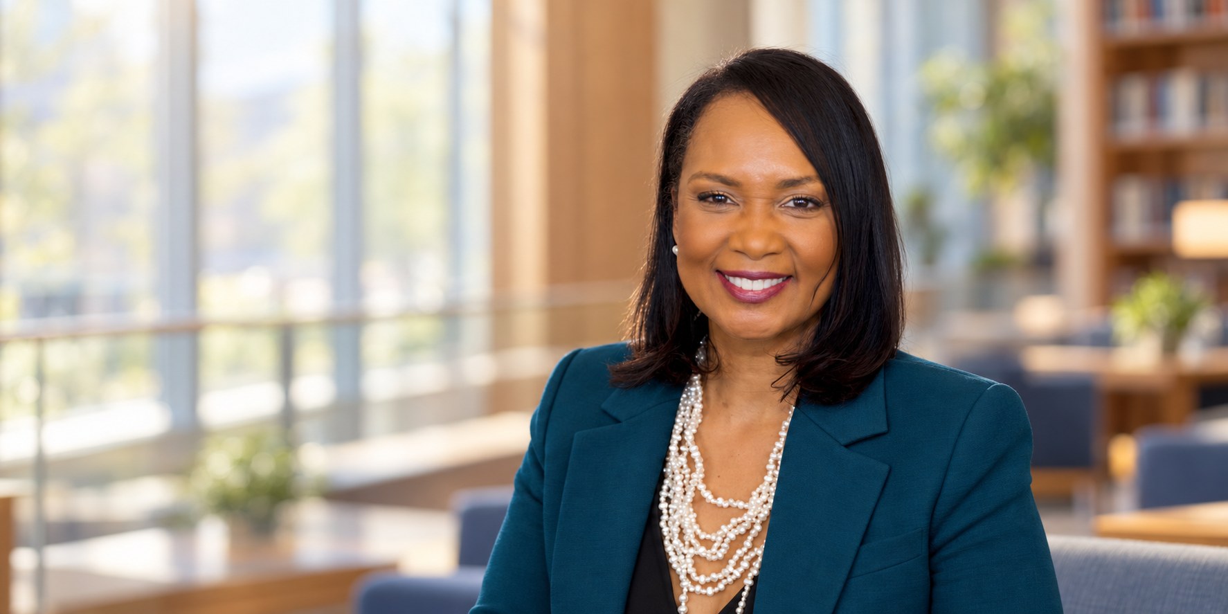 Teshia Young Roby seated in a university setting